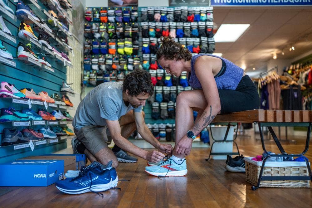 Customer gets fitted for shoes at Jus' Running running store in Asheville Customer gets fitted for shoes at Jus' Running running store in Asheville