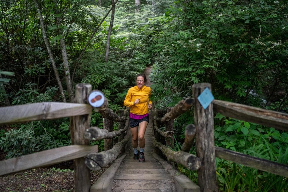 Woman running up stairs on trail in Montreat Woman running up stairs on trail in Montreat
