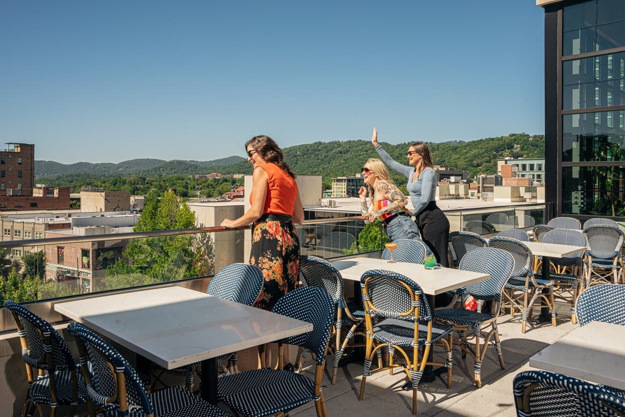 Three friends on the roof of the Restoration Hotel in Asheville, NC Three friends on the roof of the Restoration Hotel in Asheville, NC