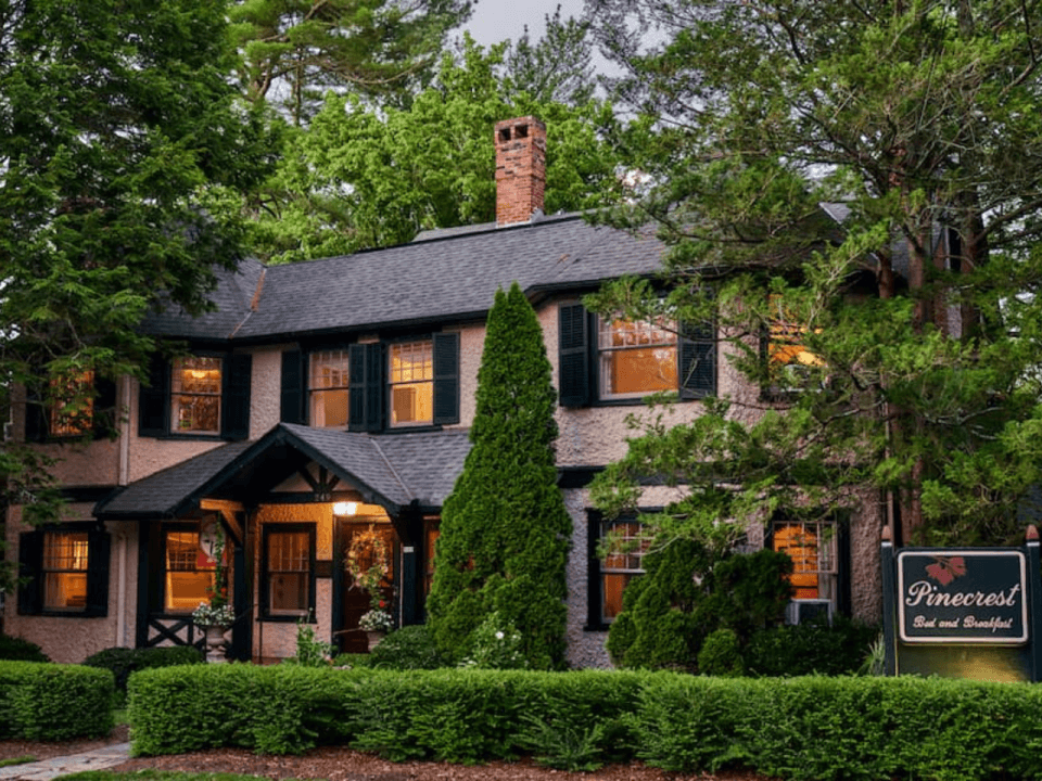Historic Pinecrest Bed & Breakfast exterior English Tudor facade with soft lighting at dusk Historic Pinecrest Bed & Breakfast exterior English Tudor facade with soft lighting at dusk