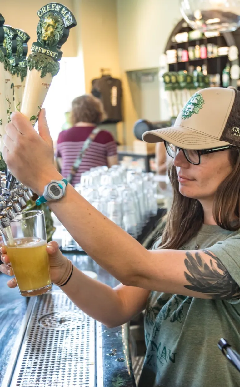 Beercation Getaway in Asheville, NC Beer pour at Green Man Brewery / Photo: Jared Kay