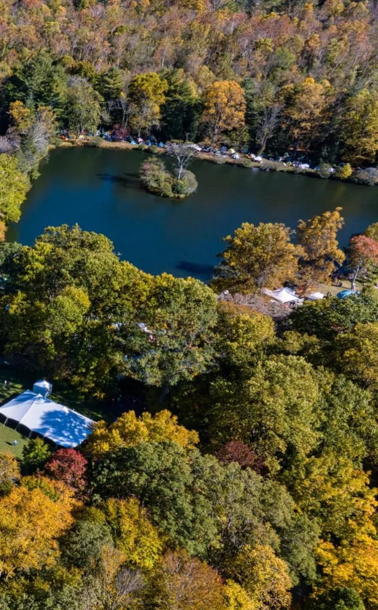 How to Experience the 2025 LEAF Retreat and Festival aerial view of global arts center with colorful trees