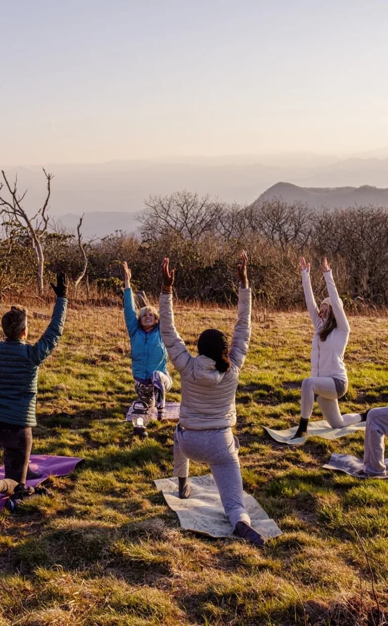 Asheville’s Ultimate Team Building Adventures Group yoga with Asheville Wellness Tours
