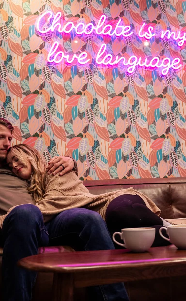 Asheville Date Night Itinerary: Romantic Couple at French Broad Chocolate Lounge / Photo: Fiasco Media